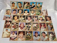 32 assorted 1962 Topps baseball cards laid out in rows showing front images of players.