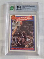 Front of graded Michael Jordan 1984 USA Basketball Team card with Mint 8.0 overall grade and subgrades visible.