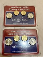 Two plastic holders each containing one Kennedy half dollar and two Sacagawea dollar coins, labeled 'Special Collector's Edition'