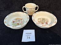 Overview of the two Bunnykins bowls and the double-handled cup, showing the designs and condition.