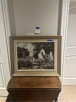 Full view of framed oil on canvas painting depicting Cape Dutch house under natural daylight