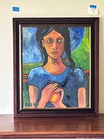 Frontal photo of the framed painting showing the full artwork and signature.