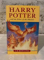 Front cover photo showing the phoenix artwork and title text.