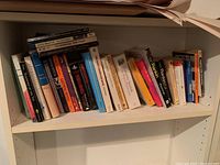 Shelf of assorted books including literature and novels by various authors.