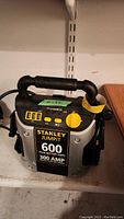 Front view of Stanley Jumpit showing control panel, handle, USB ports, power dial and brand labels.