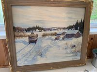 Frontal view of the framed oil painting showing winter scene