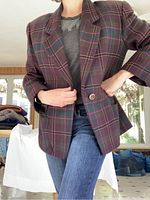 Model wearing Ellen Tracy raspberry wool and cashmere tartan blazer, size 14. Dark base with subtle red and green tartan pattern, single button closure.