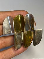 Front view of the vintage 1940's Taxco brooch showing silver and brass modernist design elements.