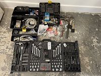 Photo of partially complete Job Mate toolbox with various hand tools and two smaller plastic toolboxes containing wires and connectors.