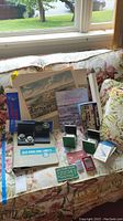 Overview of all items displayed on floral couch