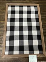Image of the rectangular pin cork board showing the full front with checkered fabric surface and wooden frame.
