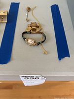 Overview of all items: wristwatch, cross pin, stick pin, tie bar and chain