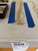 Close-up of chains on light background to show color and texture