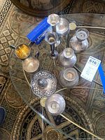 Overview of all sterling silver items on glass table