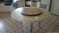 Poker table topper on metal hairpin legs with a 42" round Lazy Susan in center and plastic cover with small tear.