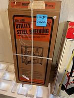 Boxed Hirsh Utility Steel Shelving Unit with 2 shelves, showing product illustration and branding.