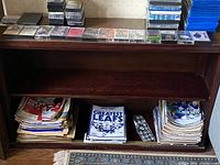 Wooden book shelf frame without shelves and without items on the shelf.