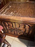 Top view showing wooden surface with scratches and wear marks.