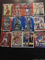 Photo of 14 near mint NFL trading cards featuring current and past players