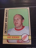 Front of the hockey card showing Gary Bergman's portrait in Detroit Red Wings jersey with team name and logo.
