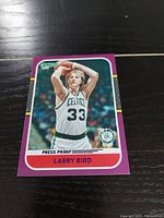 Front of Larry Bird basketball card showing player in Celtics uniform, Press Proof label, and Donruss 2022-23 branding.