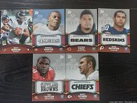 Image of seven NFL Draft football player cards from Topps showing various players including Matt Schaub, Kendall Hunter, Stephen Paea, Ryan Royster, Phil Taylor, and Riley Stanzil.