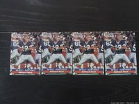 Four identical Pro Set football cards featuring Jim Kelly, quarterback for the Buffalo Bills, laid out in a row on a dark surface.