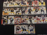 Photo showing 24 NHL Fleer Ultra hockey trading cards arranged in four rows, various players and teams represented