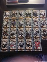 Top-down photo showing a 5x5 layout of 25 NHL trading cards arranged on black surface.