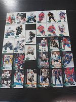 Photo showing 28 Parkhurst NHL hockey cards laid out in a grid