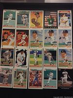 Photo showing a grid of 15 assorted 1991 MLB baseball cards featuring various players in playing positions or portraits, including some with bat, throwing or fielding poses.
