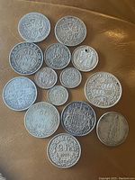 Overview of all 13 silver coins laid out