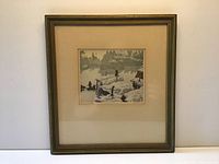 Framed artwork showing the entire frame and matting around the print.