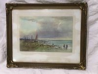 Full image of framed watercolour painting showing seaside scene with fishing boats and figures on shore.