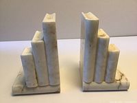 Front angle view of two marble bookends designed like stacked books.