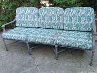 Front view of three-seater sofa with cushions in place