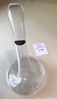 Front view of clear Riedel Cornetto decanter showing tall neck and wide base
