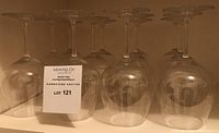 Set of 12 vintage Riedel red wine glasses arranged upside down showing clear glass and shape.