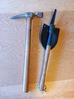 Photo showing full view of both trenching tools, the pick and the folding shovel.