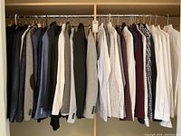 Full rack of 21 jackets and approximately 14 shirts arranged left to right