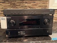 Front view of stacked Quest channel strip on top and Pioneer receiver below