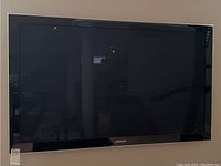 Frontal view of Samsung TV mounted on wall