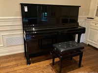 Front view of Yamaha UX3 upright piano with matching bench