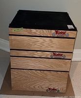 Front left angle showing stacked plywood sections and York Barbell logo
