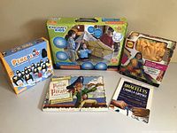 Overview of the children's toys showing five boxed items including a play tent, games, and craft kits