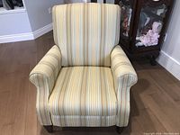 Front view of recliner showing striped upholstery and rolled arms