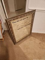 Full view of the mirror standing on the floor showing Bible verse text and frame style.