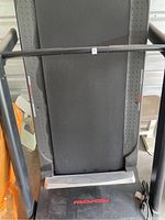 Top-down view of treadmill running surface and frame showing Pro-Form brand on lower end.