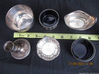 Top view showing all six sterling silver items arranged with measuring tape for scale.