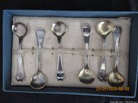 Cased set of six sterling silver salt spoons with fabric-lined case and holder straps for each spoon